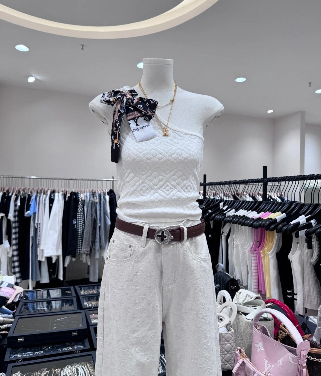 A fitted vest with a bow tie silk scarf