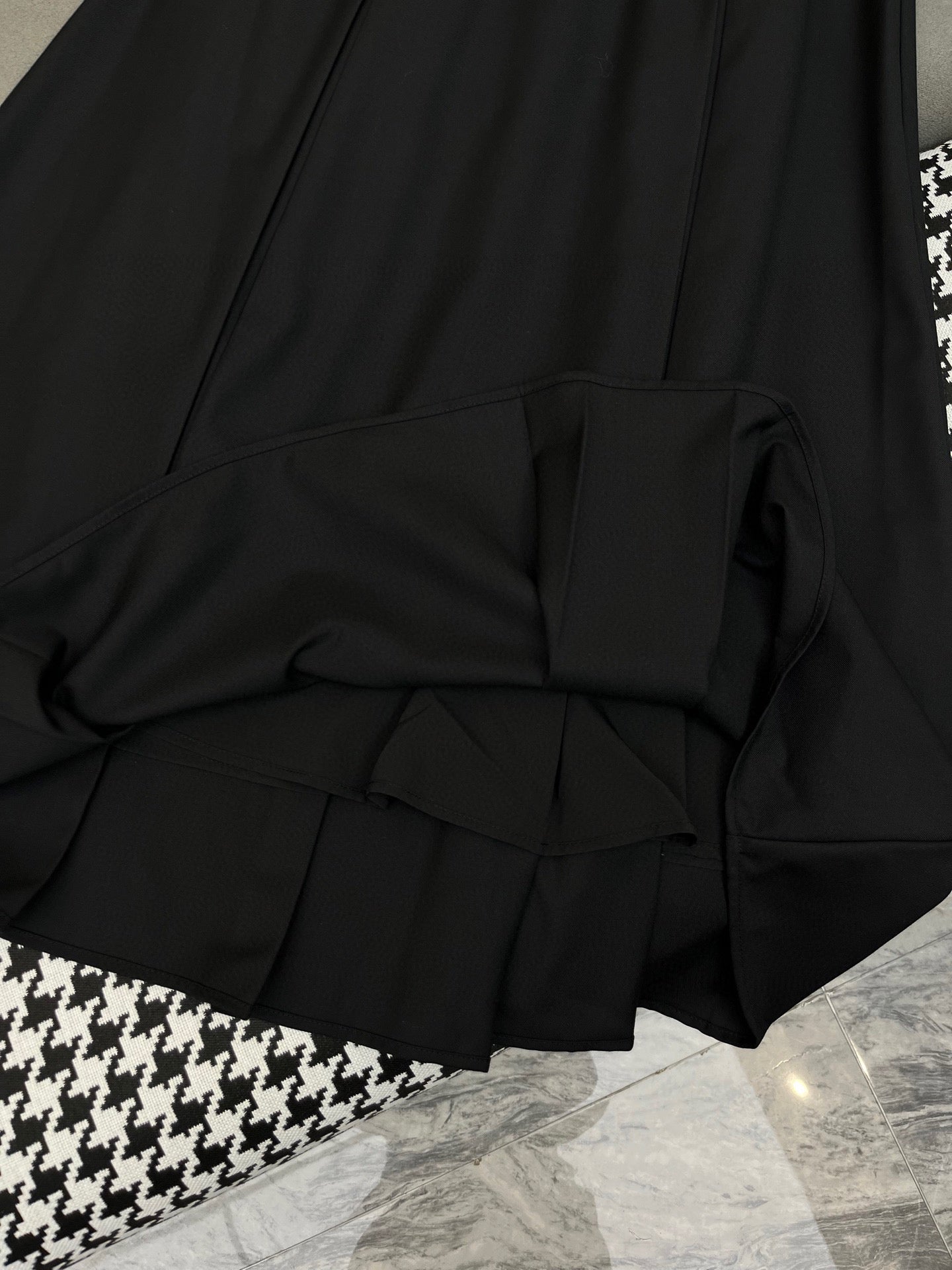 Black and white embroidered suit with gold lapel buttons