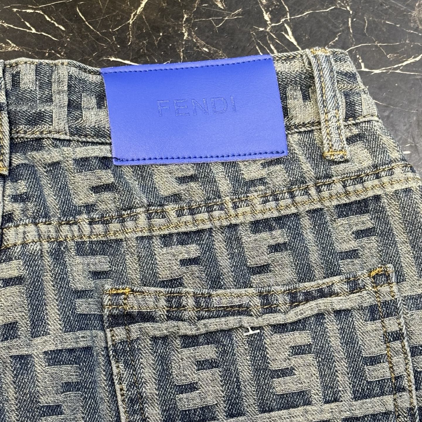 Two-tone printed denim shorts