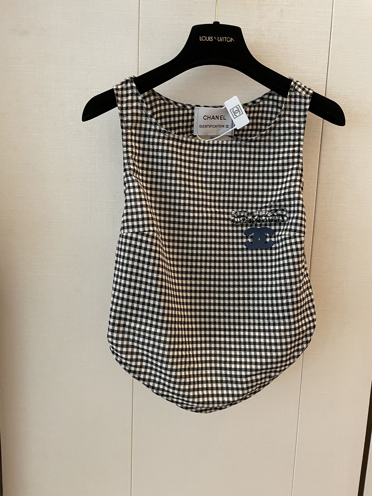 New houndstooth irregular cut back vest