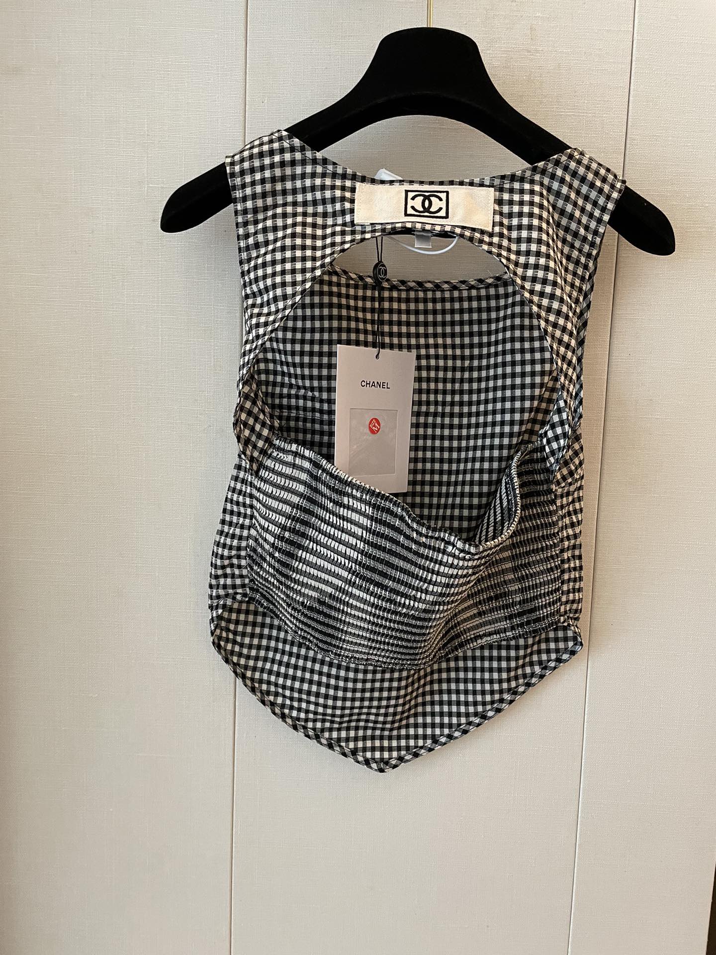 New houndstooth irregular cut back vest