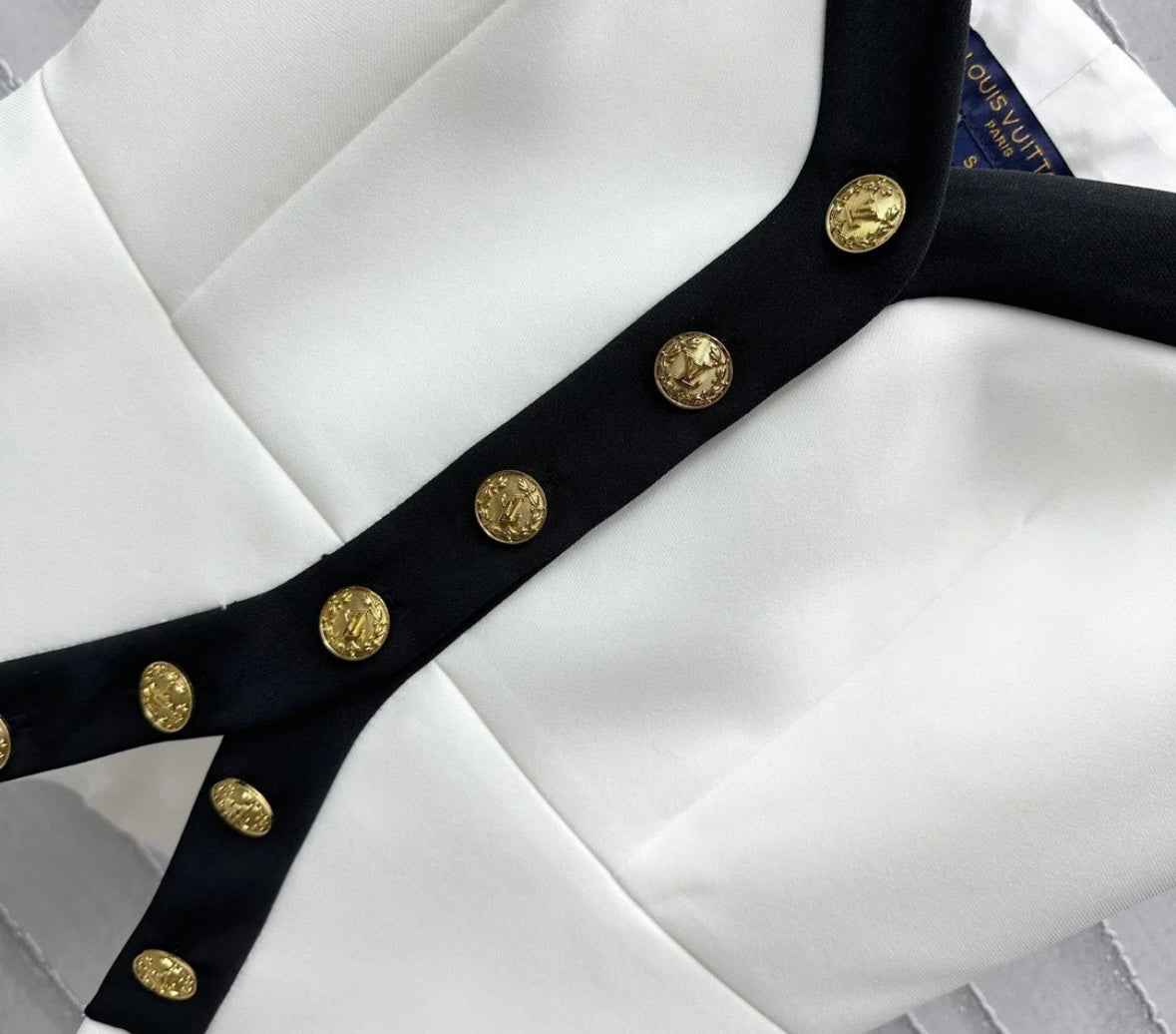 Wear a small suspender vest in a color matching suit.