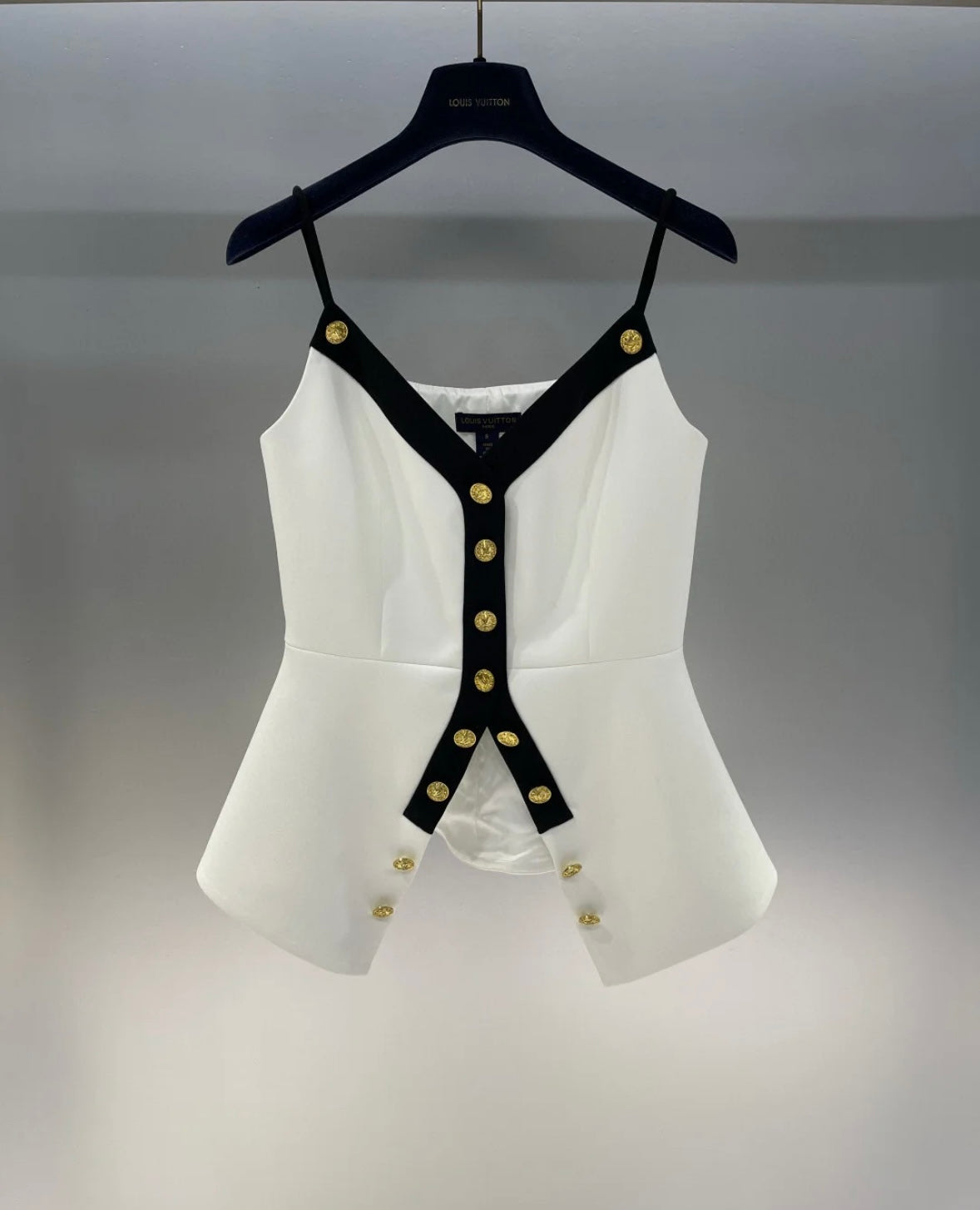 Wear a small suspender vest in a color matching suit.