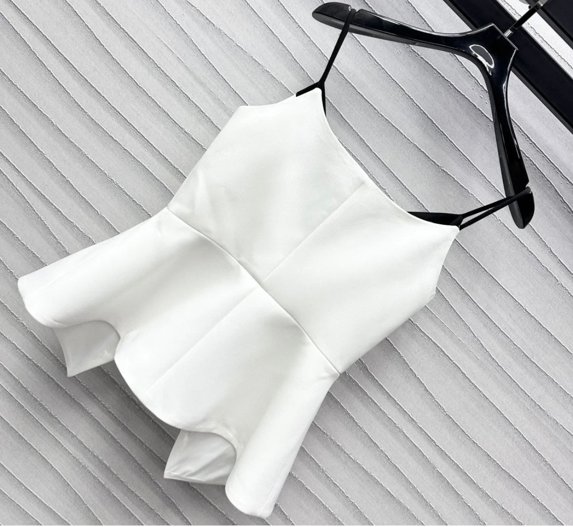 Wear a small suspender vest in a color matching suit.