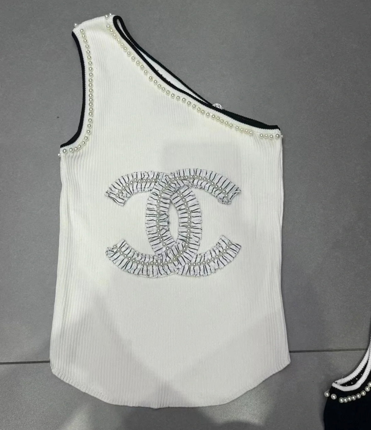 Pearl sloping shoulder vest