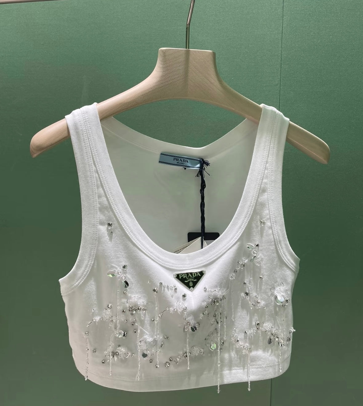 Three sizes of fringed vests
