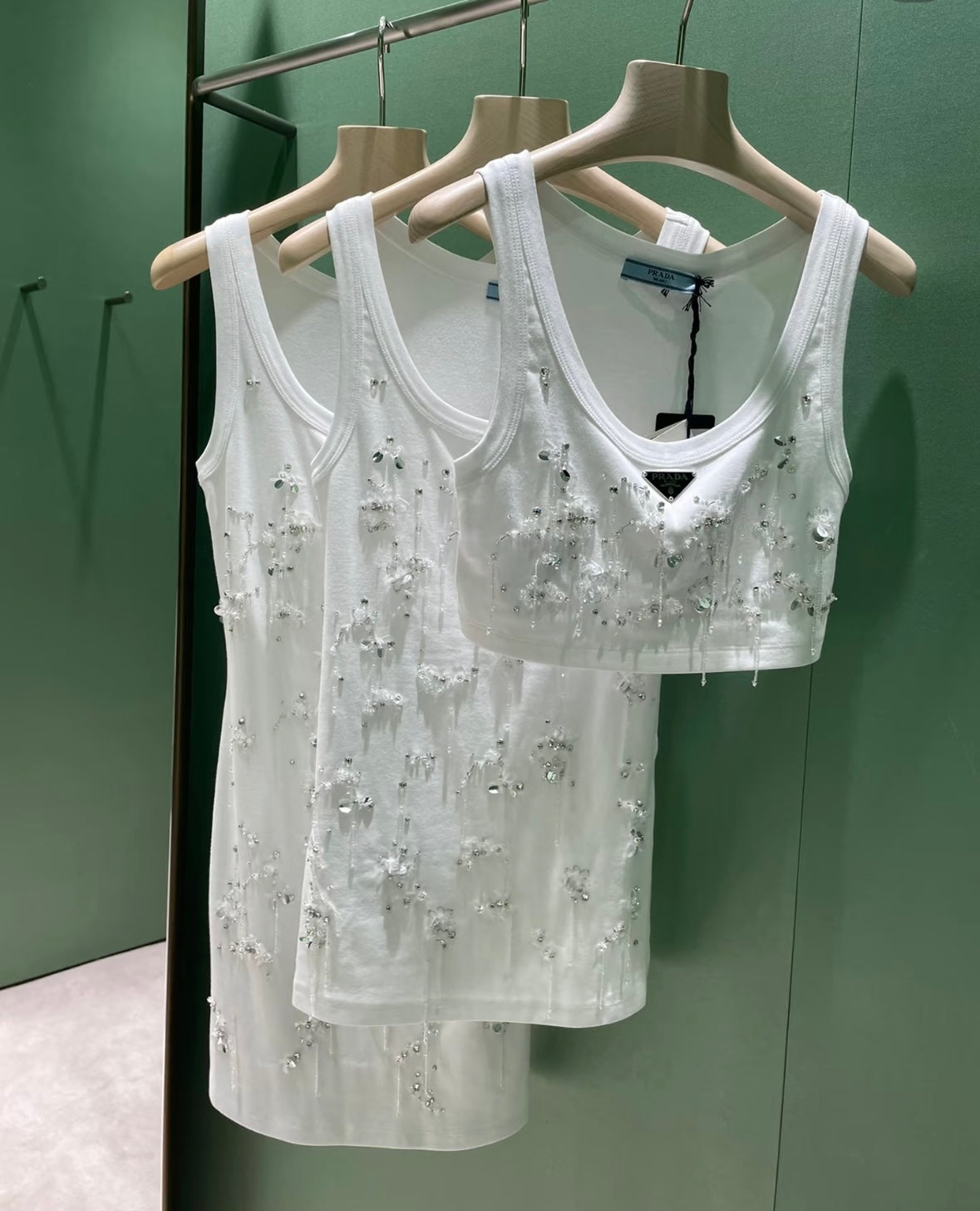 Three sizes of fringed vests