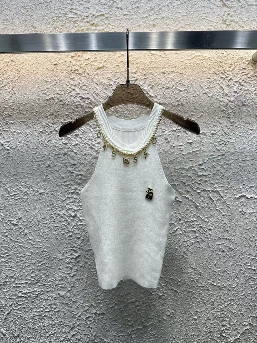 Luxurious and fashionable cropped vest with metallic embellishments