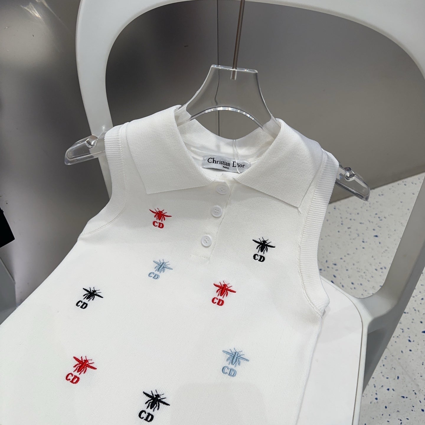 Small vest with a lapel logo print.