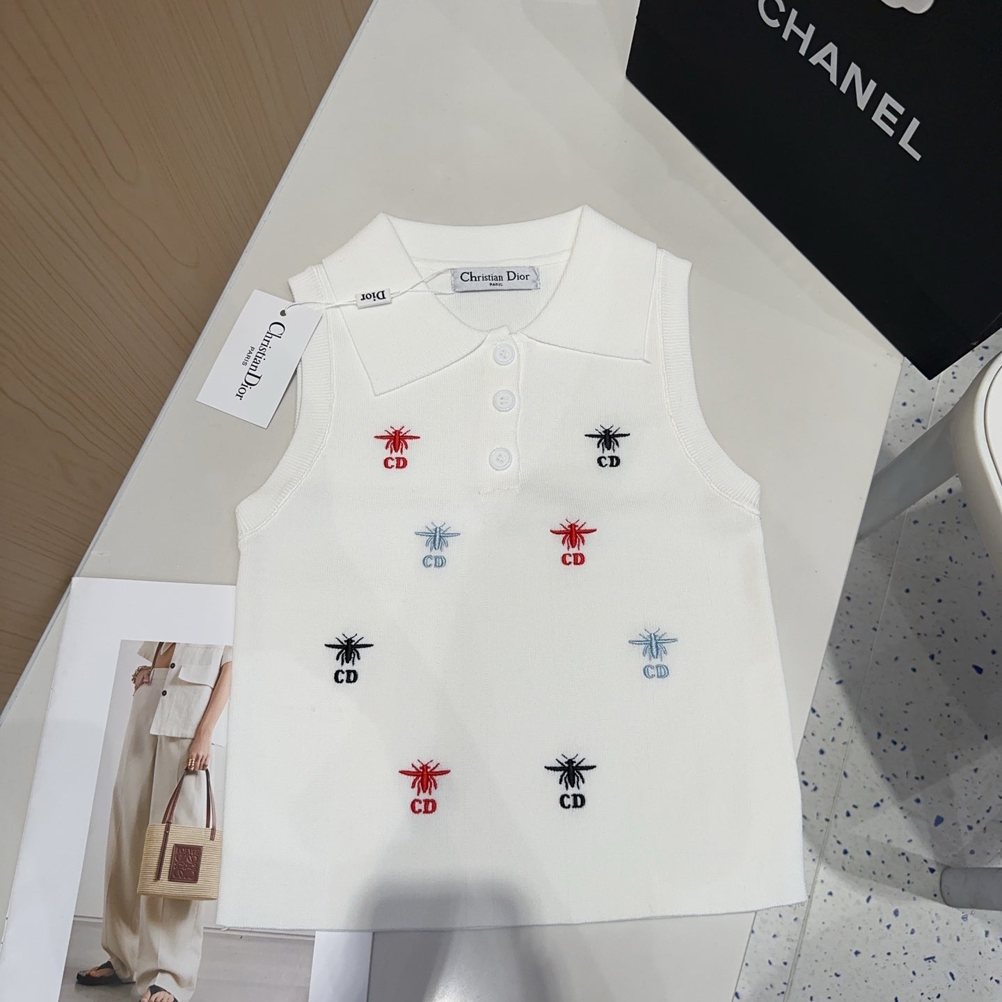 Small vest with a lapel logo print.