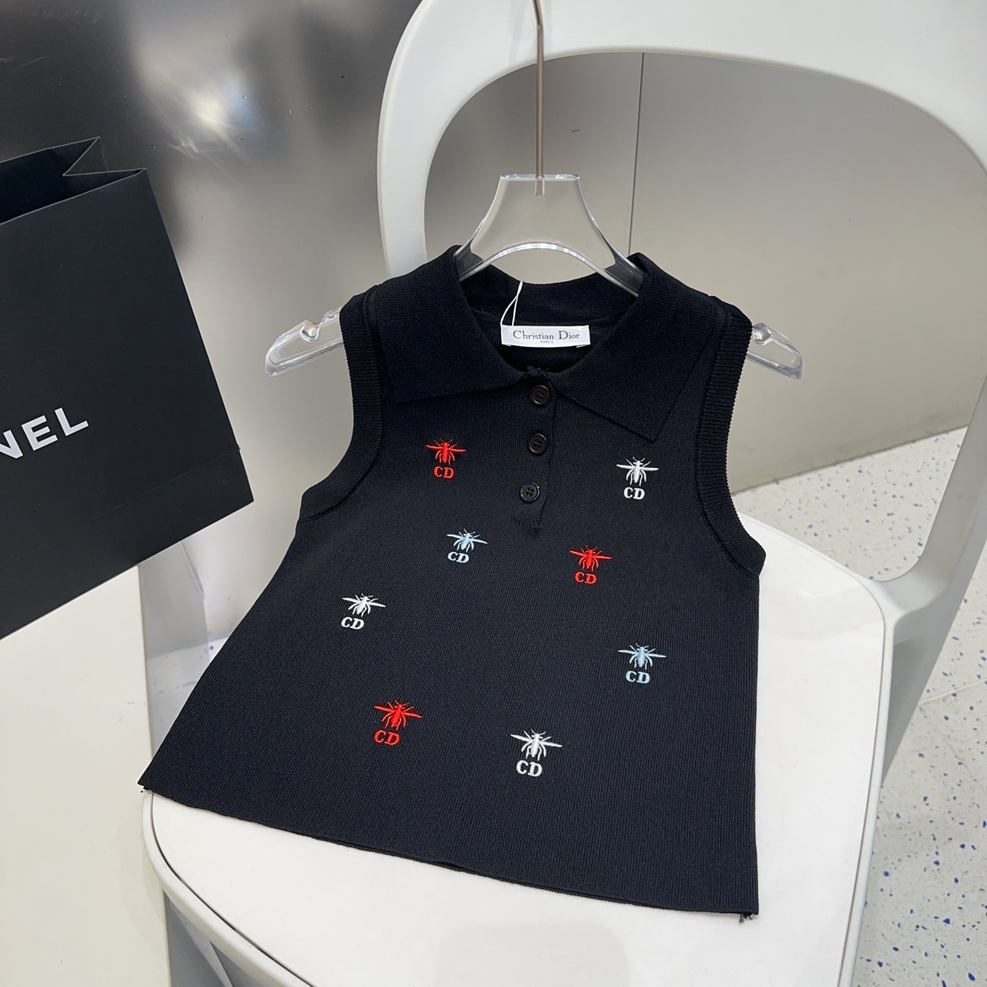 Small vest with a lapel logo print.