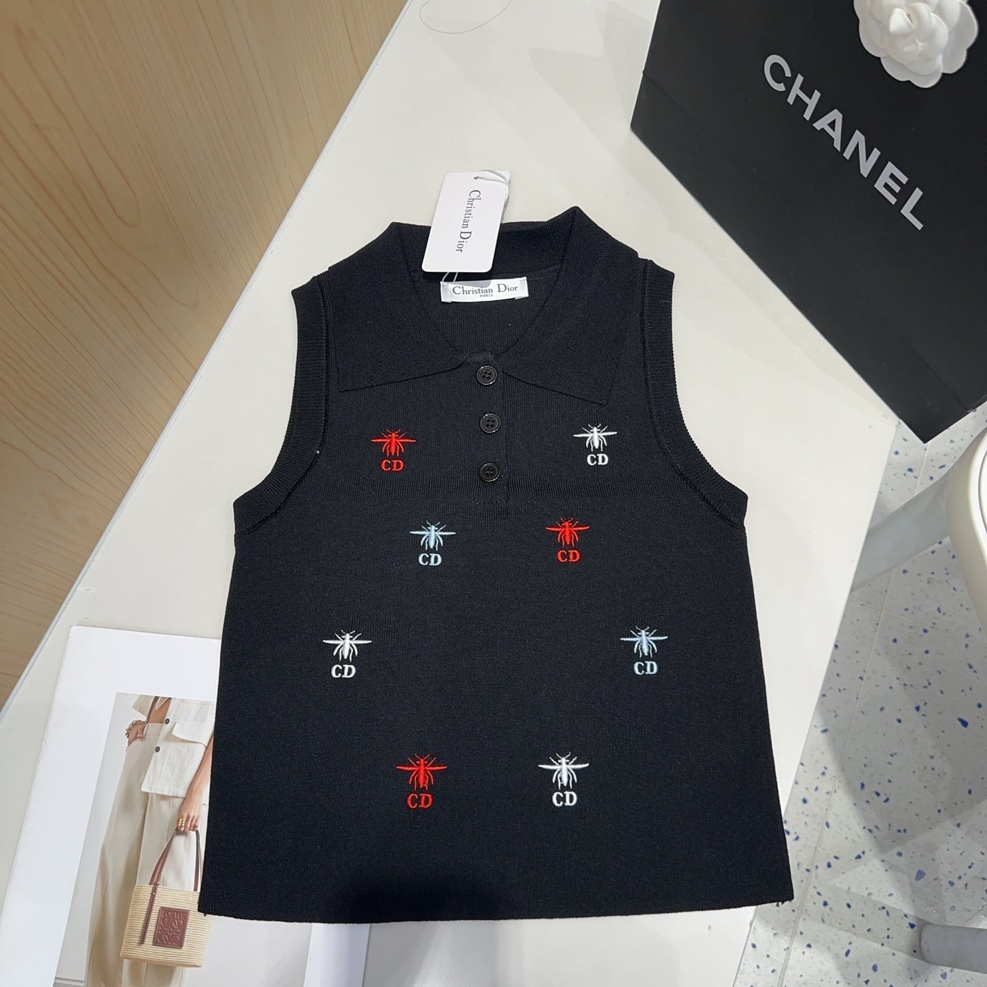 Small vest with a lapel logo print.