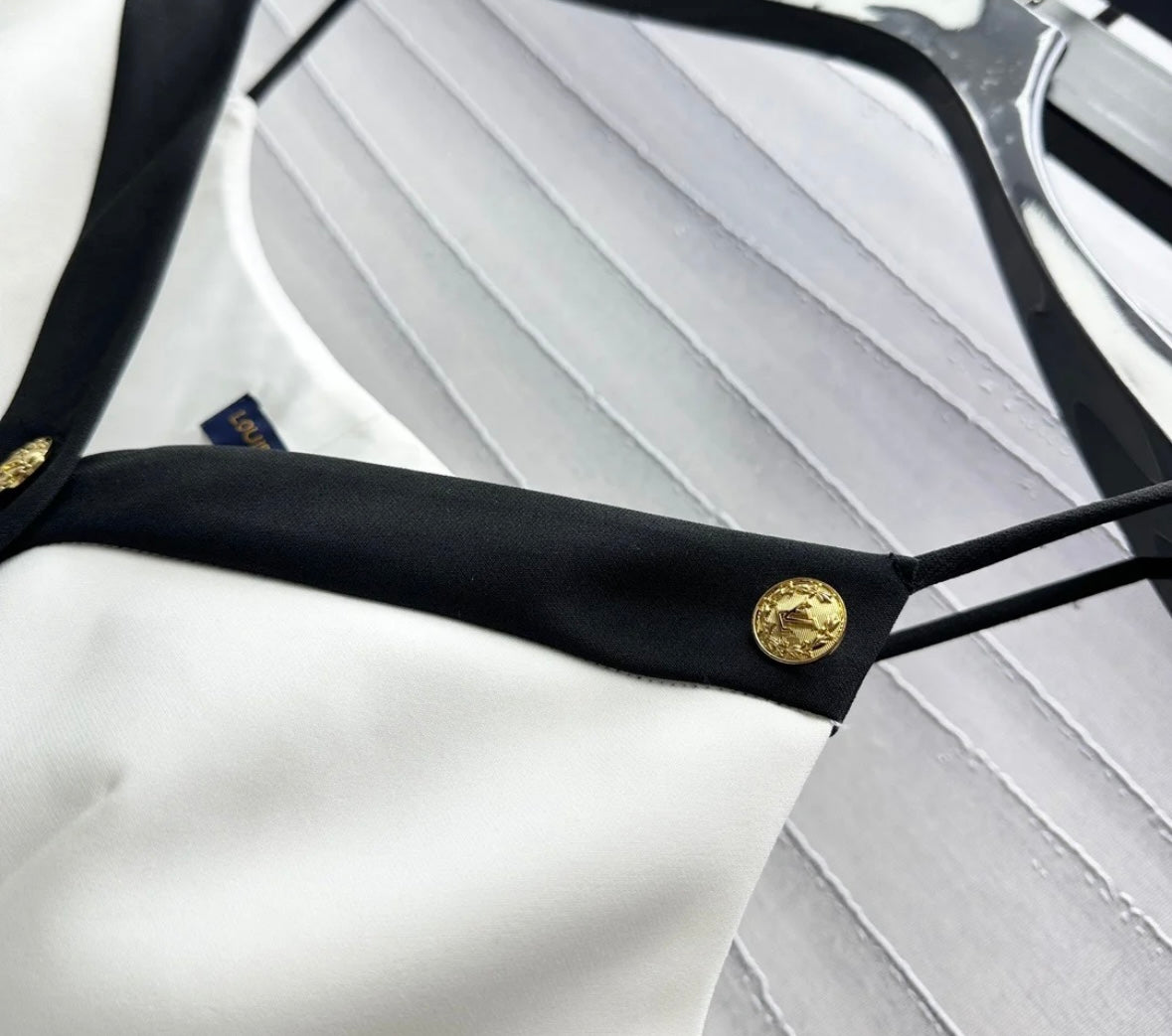 Wear a small suspender vest in a color matching suit.