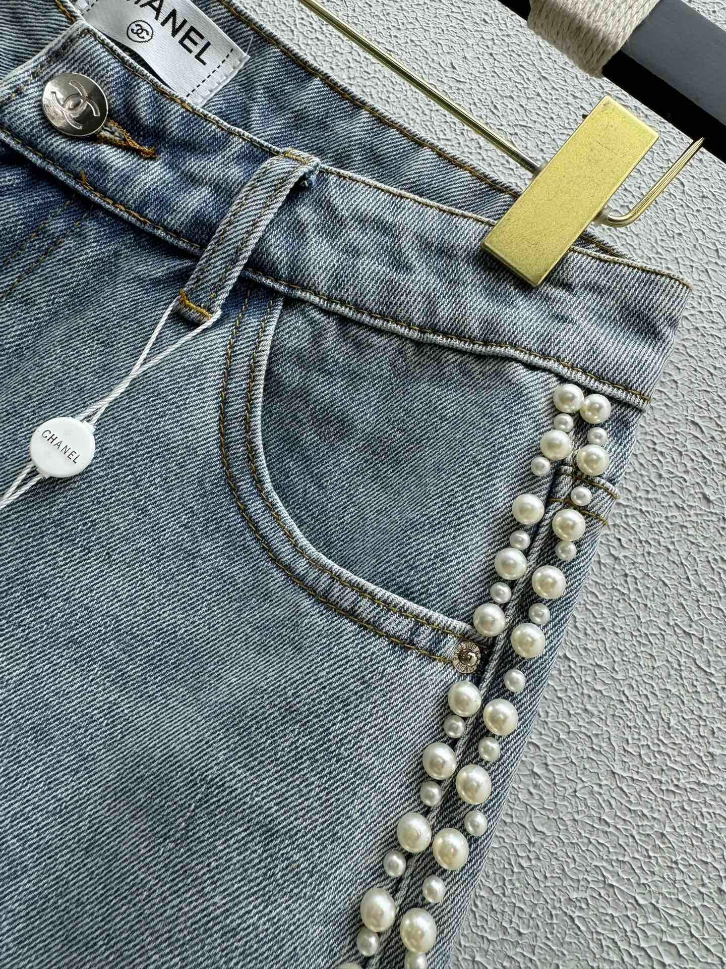 Denim shorts with pearl embellishments on both sides