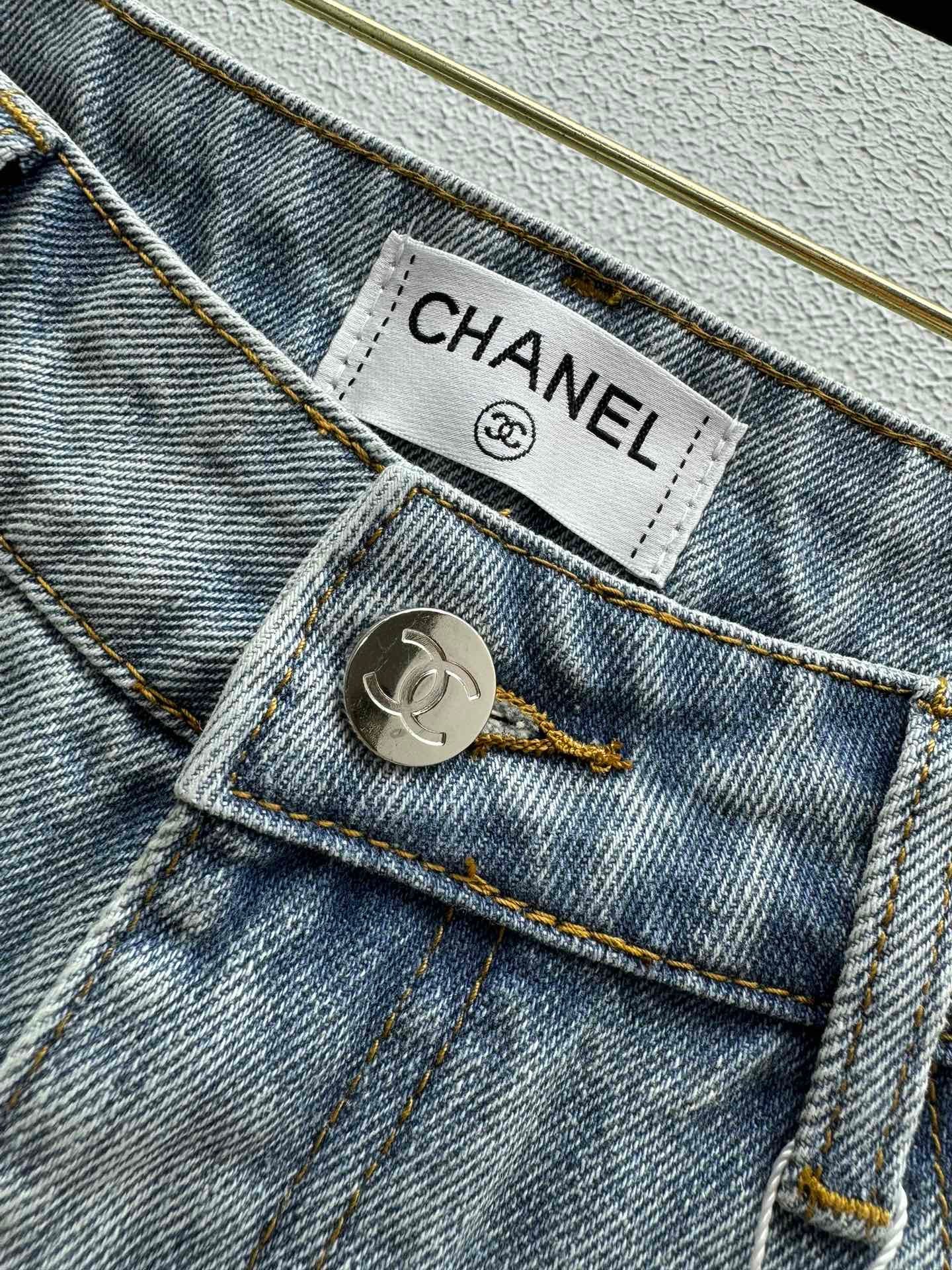 Denim shorts with pearl embellishments on both sides