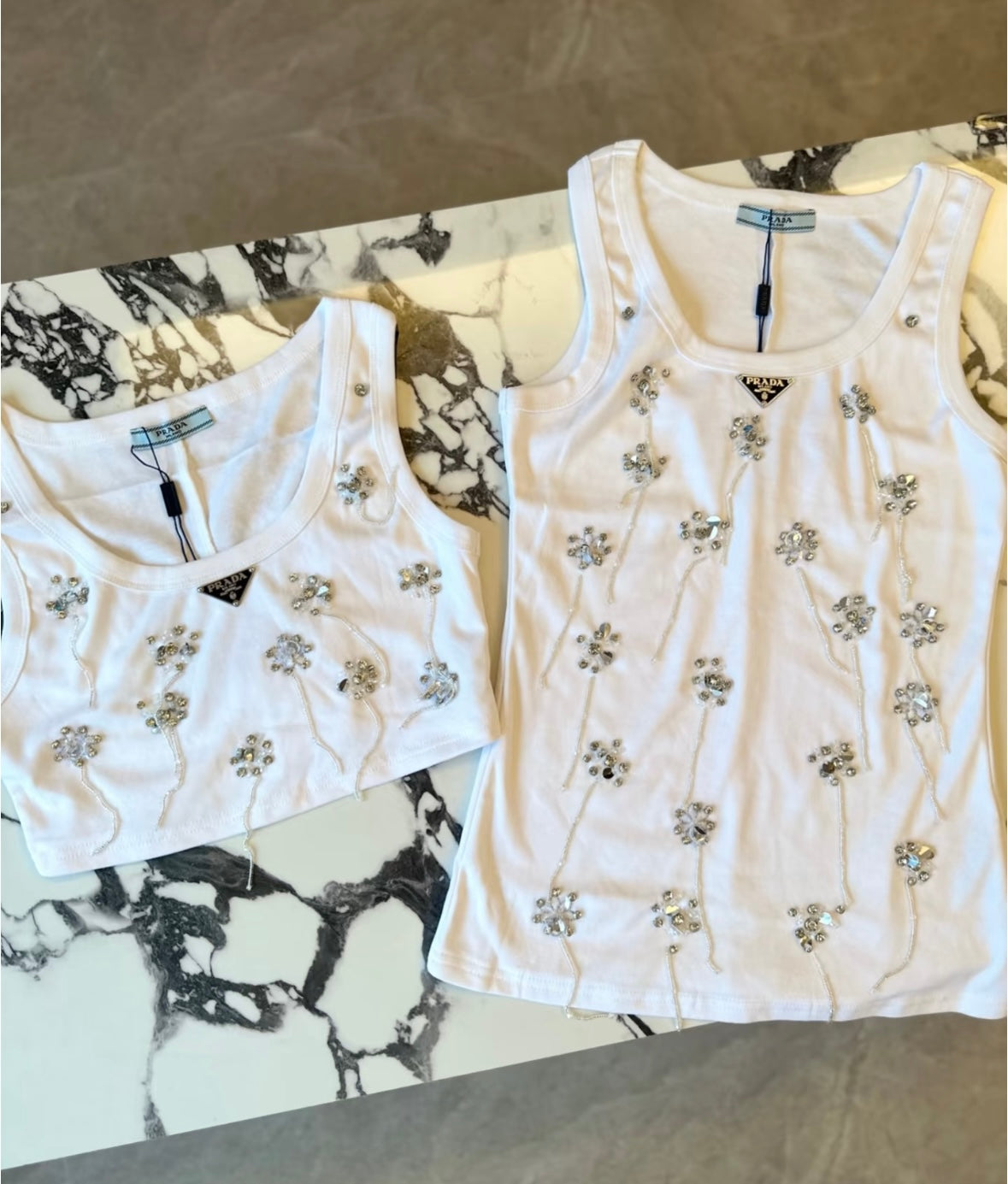 Three sizes of fringed vests